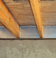 SilverGlo&trade; insulation installed in a floor joist in New Westminster