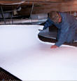 Delta insulation being installed in a crawl space.