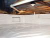 A crawl space moisture barrier installed in Delta