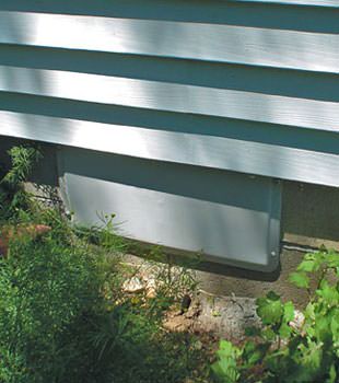 A gray crawl space vent cover in West Vancouver