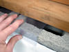 Clear plastic vapor barrier covering for block walls in Delta