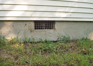 Open crawl space vents that let rodents, termites, and other pests in a home in Port Coquitlam