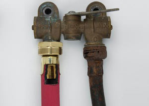 Two washer hoses, one of them our heavy duty FloodChek hose, next to an old, rusty rubber washing machine hose.