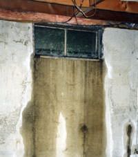 Flooding through basement windows in a Keremeos home.